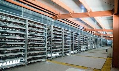 Large-scale mining farm glowing with active machines